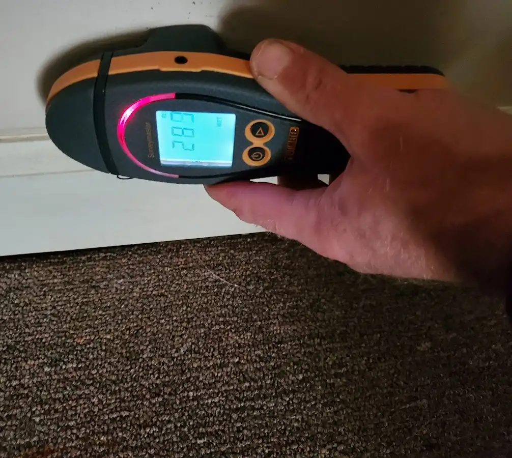 Moisture detection at baseboard during Storm Damage Restoration in Little Falls